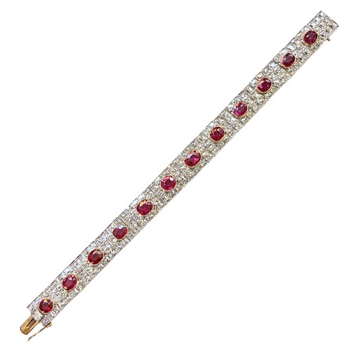 Art Deco cushion ruby and diamond strap bracelet, spaced by twelve Burma rubies, c.1920,